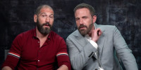 Jon Bernthal, left, and Ben Affleck speak while seated next to each other