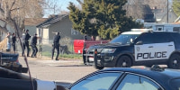 Police are seen shortly before opening fire on Victor Perez on the other side of a fence