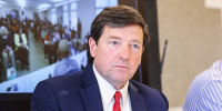 Edward Martin listening during a meeting
