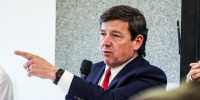 Ed Martin speaks and points while seated