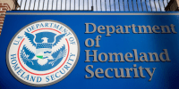 A U.S. Department of Homeland Security sign stands outside