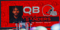 Apr 25, 2025; Green Bay, WI, USA; A graphic announcing Colorado quarterback Shedeur Sanders’ selection by the Cleveland Browns with the 144th overall pick is seen in the Draft Theater during the third day of the 2025 NFL Draft at Lambeau Field. Mandatory Credit: Tork Mason/USA Today Network via Imagn Images