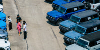 In an aerial view, Ford Broncos at a dealership.