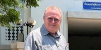 U.S. political science lecturer Paul Chambers outside the police station in Phitsanulok, Thailand, where he was arrested on charges of insulting the monarchy.