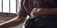 Person suffering from abdominal pain