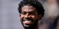  Shedeur Sanders smiling during a ceremony to retire his jersey 