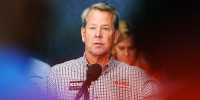 Brian Kemp speaks at a press conference