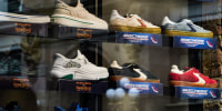 Skechers sneakers in a window display, seen from outside