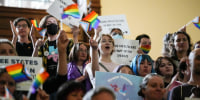 Activists protest Senate Bill 14, which bans gender-affirming medical care for transgender children, at the Texas Capitol in May 2023. 