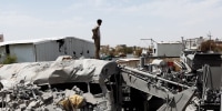 A man inspects damage
