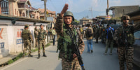 Indian paramilitary soldiers stand guard in Pampore, Pulwama district, south of Srinagar, Jammu and Kashmir.