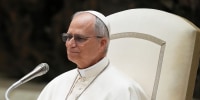 Pope Leo XIV  speaks to reporters.