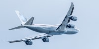 A plane flies in the sky