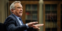  Robert F. Kennedy Jr.  gestures while speaking at a hearing.