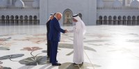 President Donald Trump shakes hands with with Yousif Al Obaidli