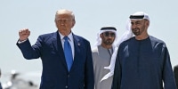 President Donald Trump is accompanied by his UAE counterpart Sheikh Mohamed bin Zayed Al Nahyan as he prepares to board Air Force One in Abu Dhabi at the end of his Middle East tour on May 16, 2025. 