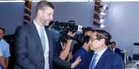Eric Trump shakes hands with Vietnam's Prime Minister Pham Minh Chinh