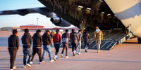 An image shared by Press Secretary Karoline Leavitt on January 24 of a deportation flight.