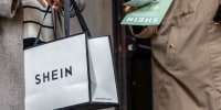 Customer carries SHEIN bag.