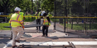 Workers put up fencing around Dupont Circle ahead of the World Pride Parade, Friday, June 6, 2025, in Washington, D.C.