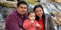 Marcos Guardado with Aracely Serrano and one of their daughters.