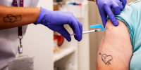 A person receives a Covid-19 vaccine