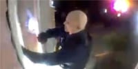 A man knocking on a door in security camera footage.