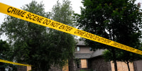 Police tape blocks off a home