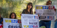 People with signs.