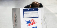 A voter casts a ballot
