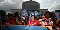 Demonstrators rally outside the Supreme Court in support of birthright citizenship 
