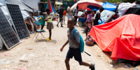 Image: A child leaves for school from a displaced persons camp