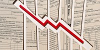 Photo Illustration: a downward trending arrow set against tax return forms