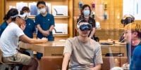 Customer tests Apple Vision Pro mixed-reality headset at