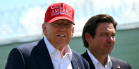 Donald Trump and Ron DeSantis tour a migrant detention center dubbed "Alligator Alcatraz" in Ochopee, Florida on July 1.