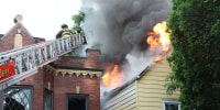 Three children were found stabbed in a burning building in Chicago’s Logan Square neighborhood on the Fourth of July, sources told NBC Chicago.