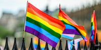 Pride flags on the fence of the Stonewall Monument