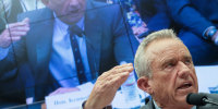 Robert F. Kennedy Jr. gestures while he speaks.