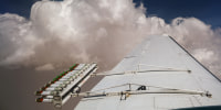 Hygroscopic flares are attached to an aircraft during a cloud seeding flight in United Arab Emirates