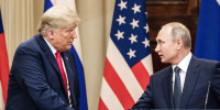 President Donald Trump and Russian President Vladimir Putin shae hands