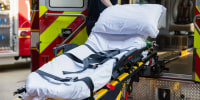 An empty stretcher in an ambulance.