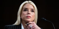 Pam Bondi  listens during her confirmation hearing.