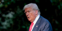 Donald Trump walks outside