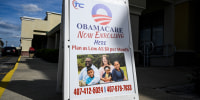 A sign advertising Obamacare health insurance enrollment