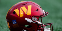 A Washington Commanders helmet on the field