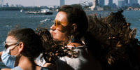 People ride on the Staten Island Ferry