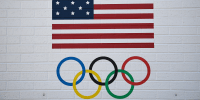 USOC logo showing a U.S. flag and the Olympic ring.