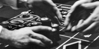 A croupier hands over a gambler's winning chips on the roulette table in Las Vegas