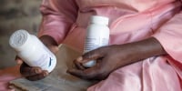 Florence Makumene holds HIV medication