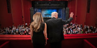 President Donald Trump and first lady Melania Trump wave from balcony at the John F. Kennedy Center for the Performing Arts